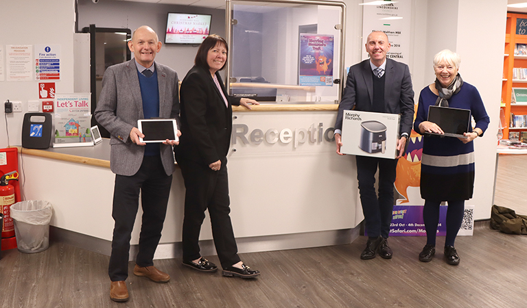 Councillors holding iPads and air fryers